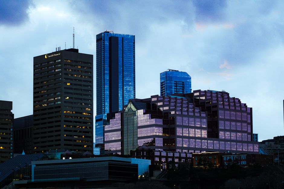 A stunning view of modern skyscrapers at twilight with reflective glass surfaces.